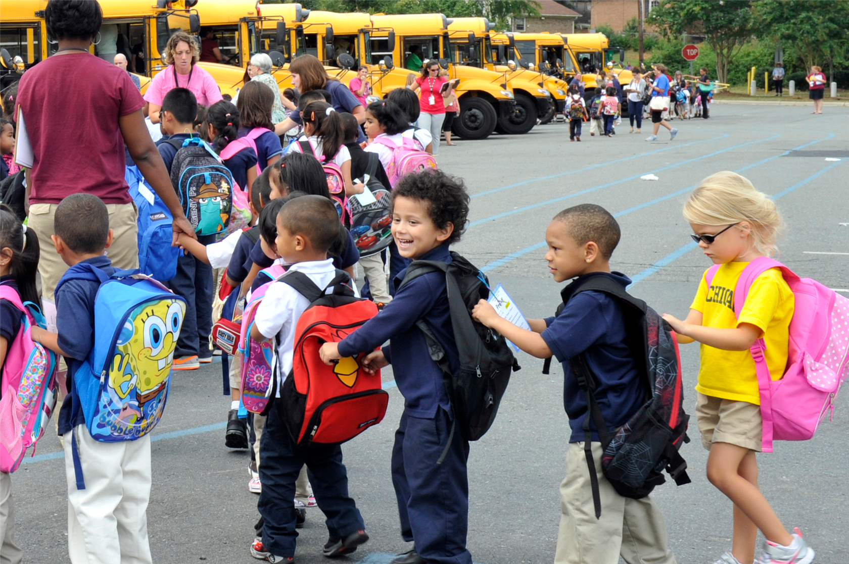Guardrail 2 - Safety | Image of students following procedure to board the bus